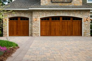 Pavers driveway wood custom garage doors, landscaping